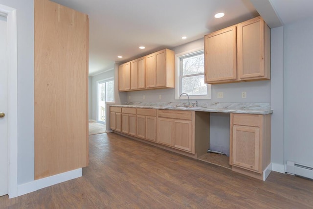 kitchen with dark wood-style flooring, light brown cabinetry, a sink, and recessed lighting