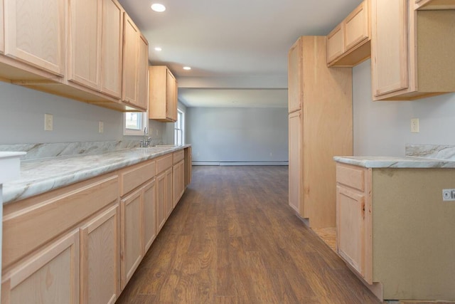 kitchen featuring a sink, light brown cabinetry, light countertops, dark wood finished floors, and recessed lighting