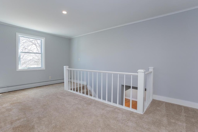 spare room featuring crown molding, a baseboard heating unit, baseboards, carpet flooring, and recessed lighting