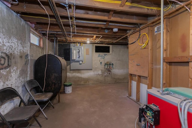 basement with electric panel, heating fuel, and a heating unit