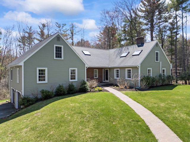 view of front facade featuring a front lawn, roof with shingles, a chimney, and a garage