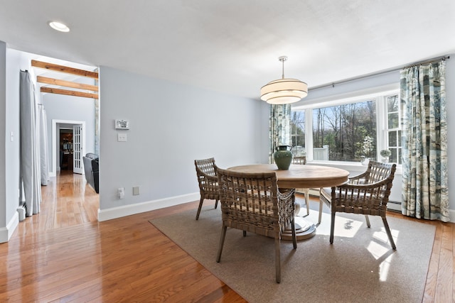 dining space featuring recessed lighting, light wood-style floors, baseboards, and baseboard heating