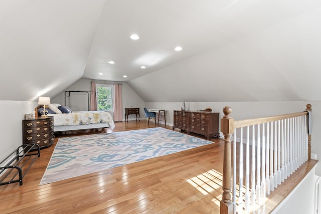 bedroom featuring wood-type flooring, vaulted ceiling, and recessed lighting