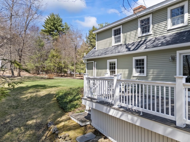 wooden terrace with a yard