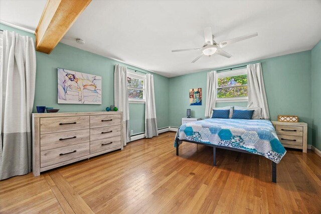 85 Tucker Ave, Portland, ME 04103 - bedroom featuring multiple windows, a ceiling fan, wood finished floors, and baseboards