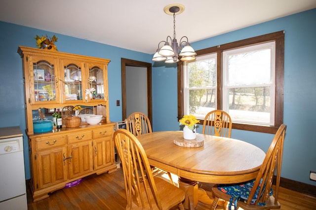 1114 Kennebec Rd, Hampden, ME 04444 - dining room with dark wood-type flooring and an inviting chandelier