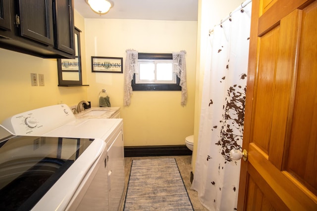 1114 Kennebec Rd, Hampden, ME 04444 - clothes washing area featuring baseboards, a sink, laundry area, and independent washer and dryer