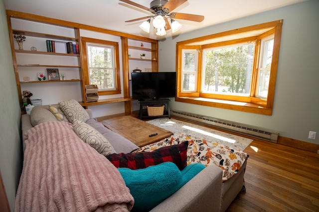 1114 Kennebec Rd, Hampden, ME 04444 - living area featuring baseboard heating, ceiling fan, baseboards, and wood finished floors