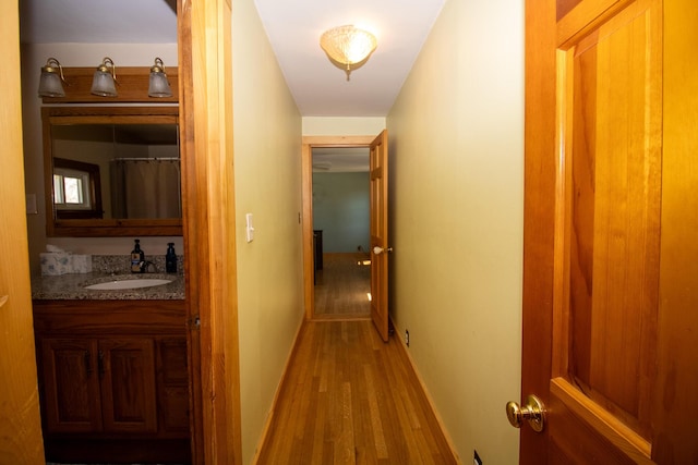 1114 Kennebec Rd, Hampden, ME 04444 - hall with baseboards, wood finished floors, and a sink