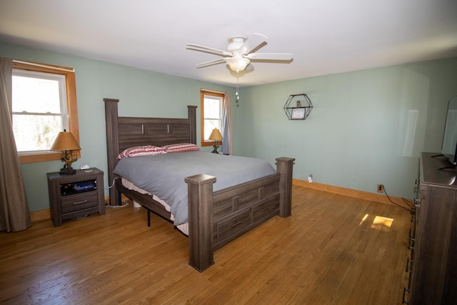 1114 Kennebec Rd, Hampden, ME 04444 - bedroom featuring baseboards, a ceiling fan, and light wood-style floors