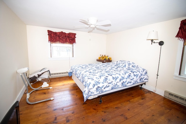 1114 Kennebec Rd, Hampden, ME 04444 - bedroom with baseboard heating, baseboards, a baseboard heating unit, and hardwood / wood-style floors