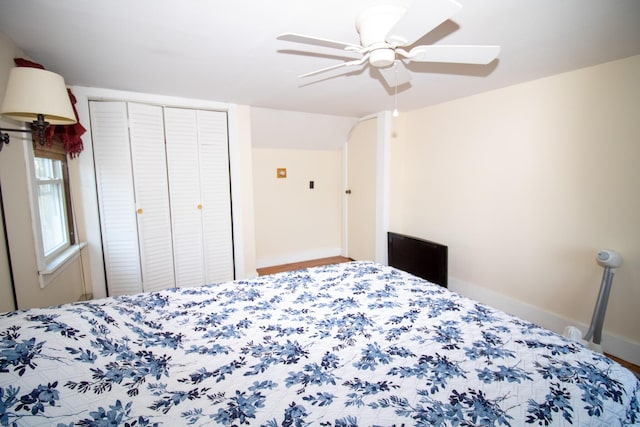 1114 Kennebec Rd, Hampden, ME 04444 - bedroom with baseboards, arched walkways, a ceiling fan, and a closet