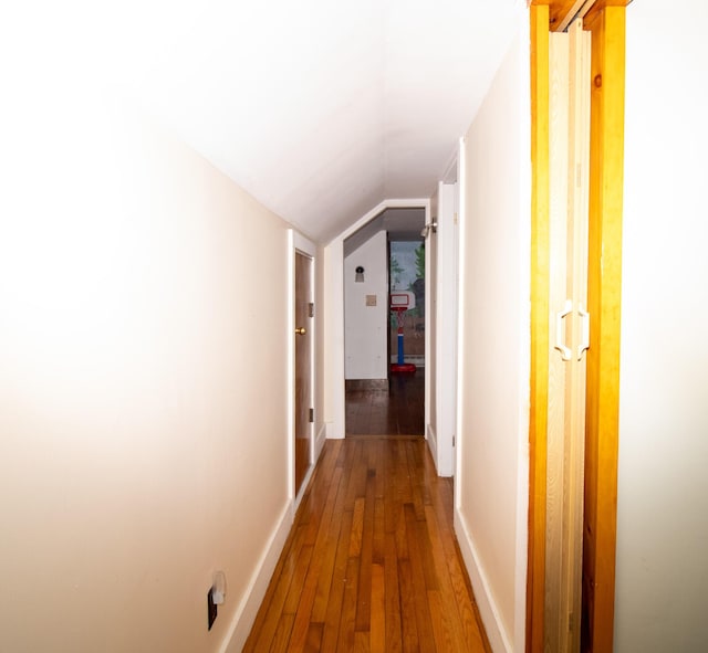 1114 Kennebec Rd, Hampden, ME 04444 - corridor featuring baseboards, lofted ceiling, and hardwood / wood-style flooring