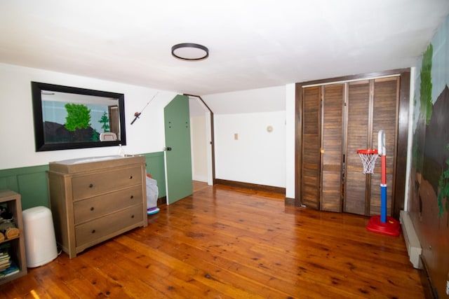 1114 Kennebec Rd, Hampden, ME 04444 - bonus room with baseboard heating, wood-type flooring, and a wainscoted wall