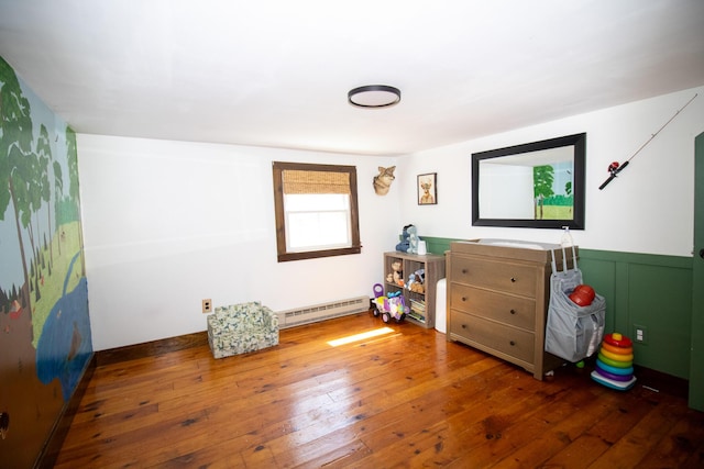 1114 Kennebec Rd, Hampden, ME 04444 - bedroom with hardwood / wood-style floors, baseboard heating, and wainscoting