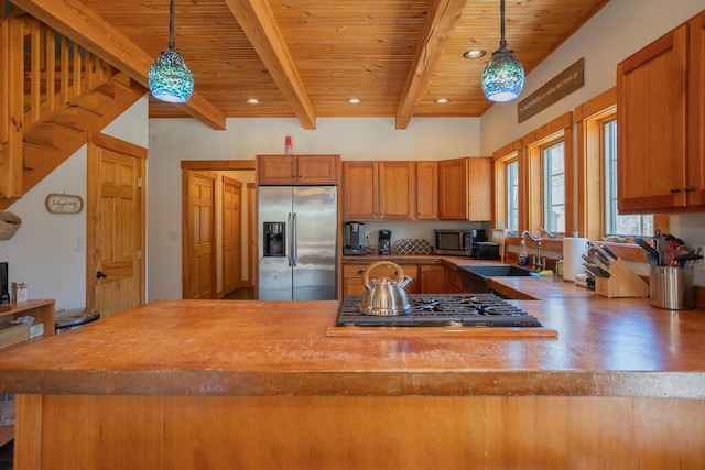 8 Sunset Ln, Kingfield, ME 04947 - kitchen featuring a sink, brown cabinetry, wooden ceiling, appliances with stainless steel finishes, and beam ceiling