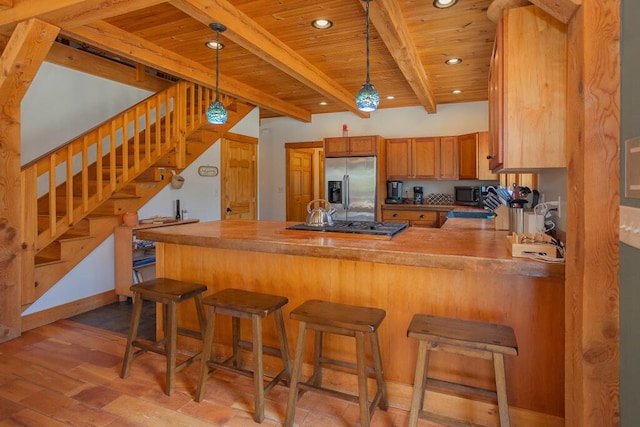 8 Sunset Ln, Kingfield, ME 04947 - kitchen with a peninsula, light wood-style floors, appliances with stainless steel finishes, and wood ceiling