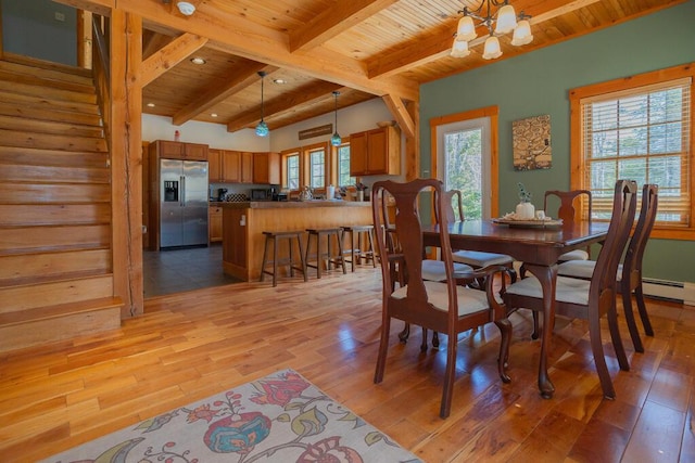 8 Sunset Ln, Kingfield, ME 04947 - dining space featuring light wood-type flooring, wooden ceiling, beam ceiling, and a chandelier