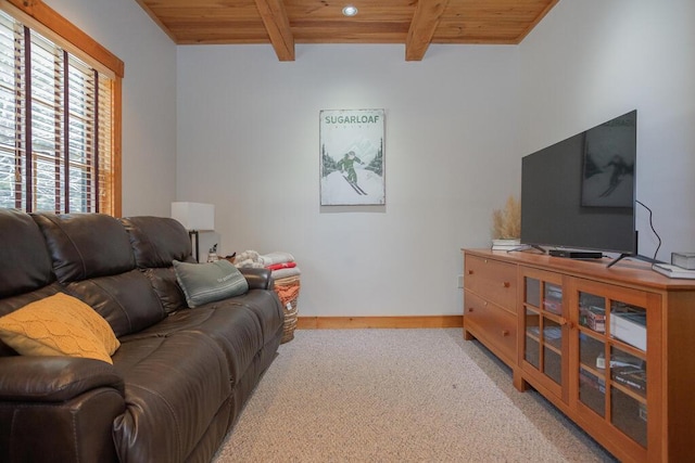 8 Sunset Ln, Kingfield, ME 04947 - living room featuring beamed ceiling, baseboards, wood ceiling, and light colored carpet