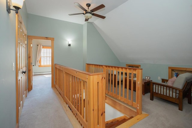 8 Sunset Ln, Kingfield, ME 04947 - corridor with lofted ceiling, baseboard heating, carpet, and an upstairs landing