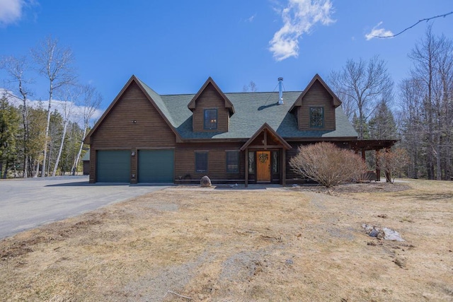 8 Sunset Ln, Kingfield, ME 04947 - view of front of home featuring an attached garage, a shingled roof, and aphalt driveway
