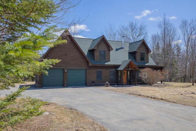 8 Sunset Ln, Kingfield, ME 04947 - view of front of property with an attached garage, a shingled roof, and aphalt driveway