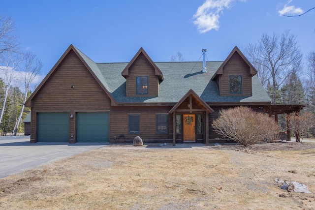 8 Sunset Ln, Kingfield, ME 04947 - view of front facade featuring aphalt driveway, a shingled roof, and a garage