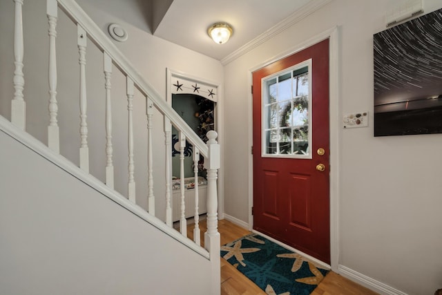 390 Castine Rd, Castine, ME 04421 - foyer with stairway, light wood finished floors, baseboards, and ornamental molding