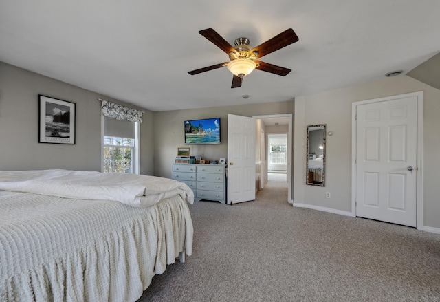 390 Castine Rd, Castine, ME 04421 - bedroom featuring carpet floors, multiple windows, a ceiling fan, and baseboards