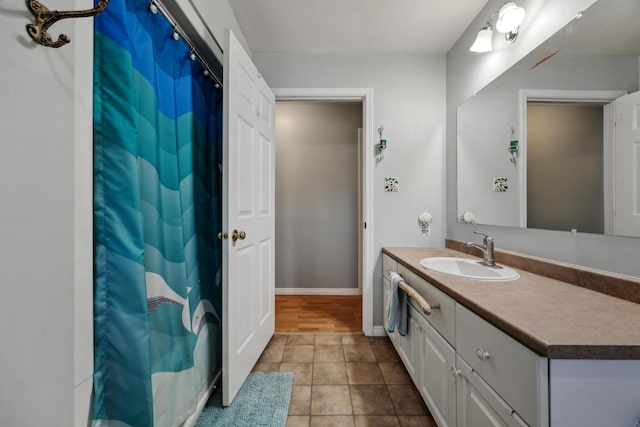 390 Castine Rd, Castine, ME 04421 - bathroom with vanity, tile patterned flooring, baseboards, and curtained shower