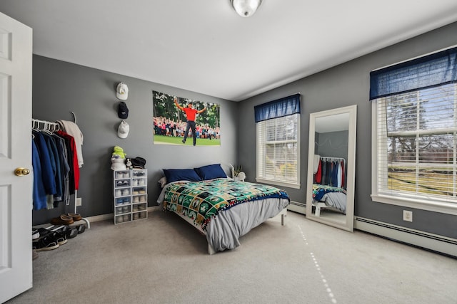 390 Castine Rd, Castine, ME 04421 - bedroom with multiple windows, carpet flooring, and a baseboard heating unit
