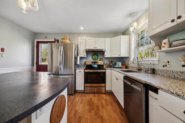 390 Castine Rd, Castine, ME 04421 - kitchen featuring stainless steel appliances, a sink, under cabinet range hood, healthy amount of natural light, and recessed lighting
