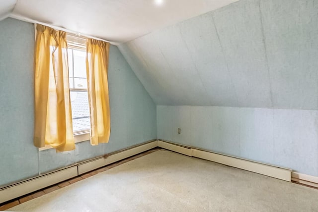bonus room with lofted ceiling, a baseboard radiator, and carpet floors