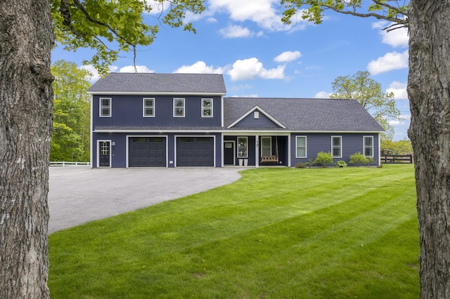 17 Wadlin Rd, Biddeford, ME 04005 - view of front facade with asphalt driveway, a garage, covered porch, and a shingled roof
