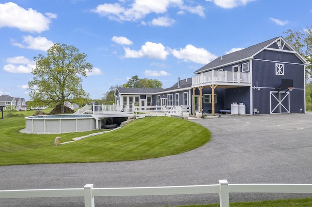 17 Wadlin Rd, Biddeford, ME 04005 - rear view of property featuring a deck, an outdoor pool, a barn, and driveway