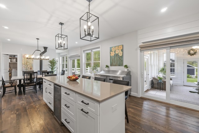 17 Wadlin Rd, Biddeford, ME 04005 - kitchen with a chandelier, white cabinetry, dark wood-style flooring, light countertops, and recessed lighting