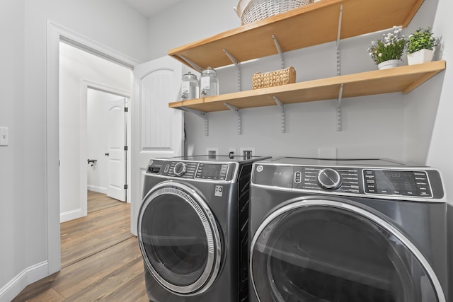 17 Wadlin Rd, Biddeford, ME 04005 - laundry room with separate washer and dryer, wood finished floors, and baseboards
