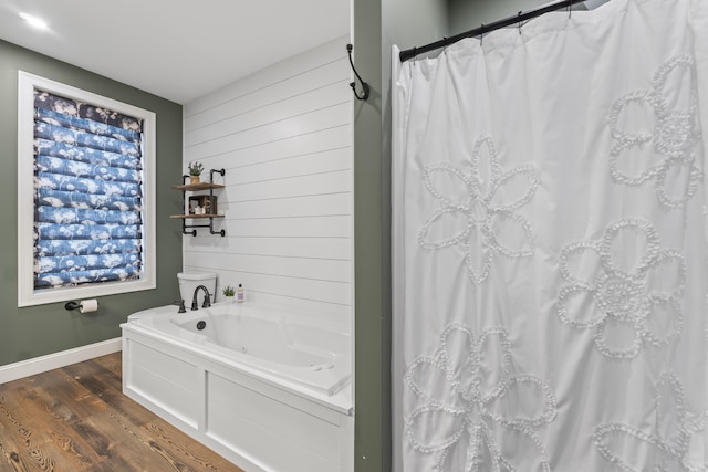 17 Wadlin Rd, Biddeford, ME 04005 - bathroom featuring wood finished floors, a jetted tub, baseboards, curtained shower, and wood walls