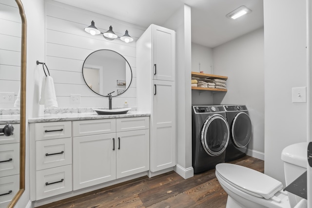 17 Wadlin Rd, Biddeford, ME 04005 - bathroom with washing machine and clothes dryer, wood finished floors, toilet, vanity, and baseboards