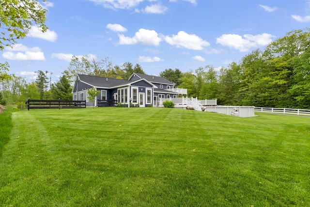 17 Wadlin Rd, Biddeford, ME 04005 - rear view of house with a swimming pool, a sunroom, and a deck