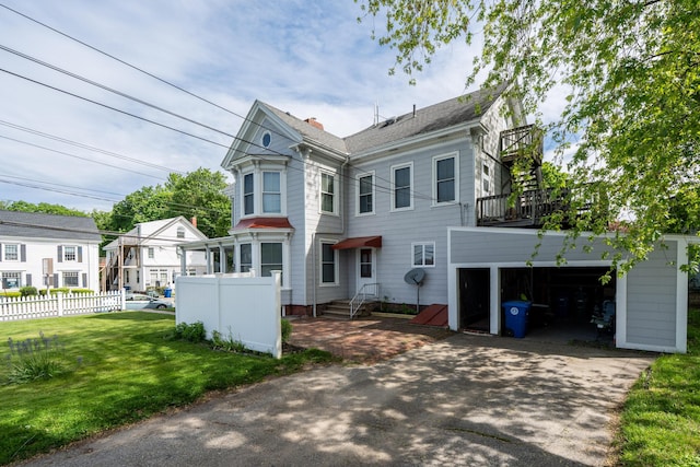 546 Main St, Westbrook, ME 04092 - victorian house featuring a garage, asphalt driveway, and entry steps