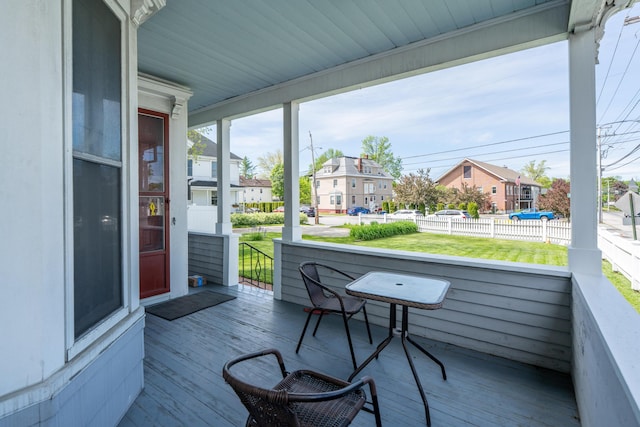 546 Main St, Westbrook, ME 04092 - porch with a residential view and a lawn