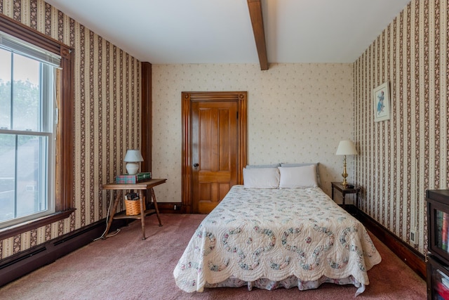 546 Main St, Westbrook, ME 04092 - bedroom featuring multiple windows, beam ceiling, wallpapered walls, and carpet floors