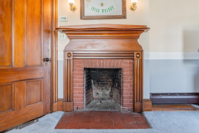 546 Main St, Westbrook, ME 04092 - detailed view of a baseboard radiator, a brick fireplace, and carpet flooring