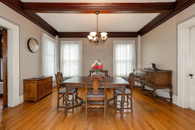 546 Main St, Westbrook, ME 04092 - dining room with a chandelier, crown molding, and light wood-type flooring