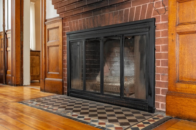 546 Main St, Westbrook, ME 04092 - detailed view of wood finished floors and a brick fireplace