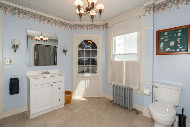 546 Main St, Westbrook, ME 04092 - full bathroom with radiator heating unit, a chandelier, vanity, toilet, and baseboards