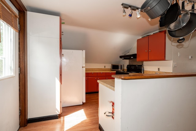 546 Main St, Westbrook, ME 04092 - kitchen with freestanding refrigerator, stainless steel microwave, black electric range, light wood finished floors, and extractor fan