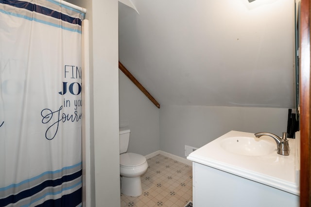 546 Main St, Westbrook, ME 04092 - bathroom with toilet, vanity, lofted ceiling, baseboards, and a shower with shower curtain