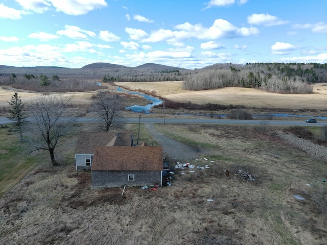 birds eye view of property with a mountain view and a rural view